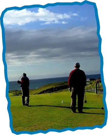 Two people stand on a grassy golf course near the sea in Explore Strandhill Sligo, one preparing to swing a club while the other watches. The sky is partly cloudy, and the scene is framed with a jagged blue border.